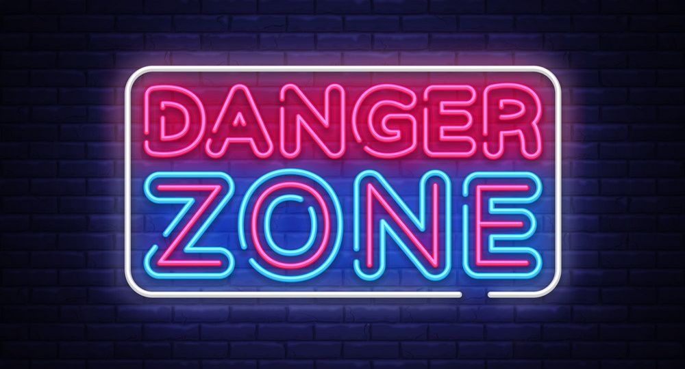 Danger Zone neon signs vector design template. Danger Zone neon symbol, light banner design element colorful modern design trend, night bright advertising, bright sign. Vector illustration